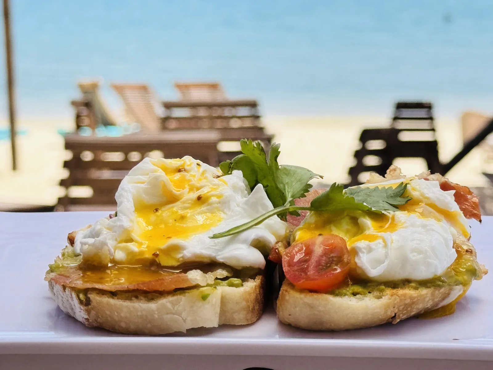 Poached eggs on toast, by the beach